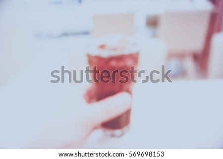 Picture blurred  for background abstract and can be illustration to article of hand hold cola glass
