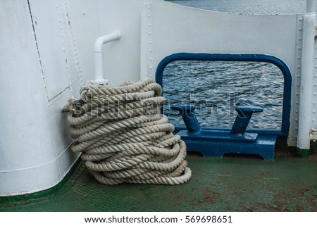 Ship rough rope roll on deck of vessel.