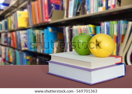 Book and very blurry library back ground for education concept