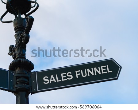 Street lighting pole with conceptual message Sales Funnel on directional arrow over blue cloudy background.
