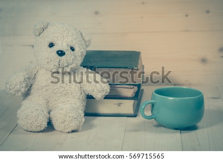 bear toy with cup of coffee