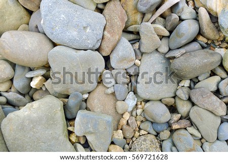 Background with river stones. Stones on the beach.