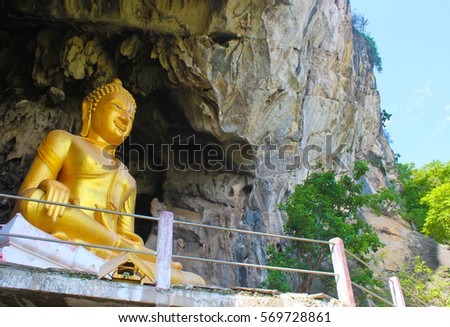 golden buddha statue at erawan cave(Wat tham erawan temple) Nongbualumphu province, thailand.