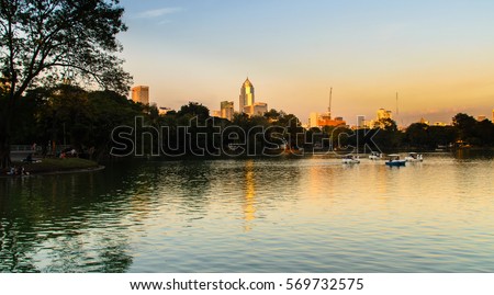 The view of buildings and lake in Bangkok ,Thailand with twilight sky