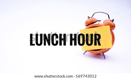 LUNCH HOUR text on a clock with a white background. Business Concept.