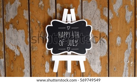 Happy 4th of July sign on wooden background


