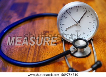 Stethoscope and Clock on a wooden table, concept of Time Problems. tone image