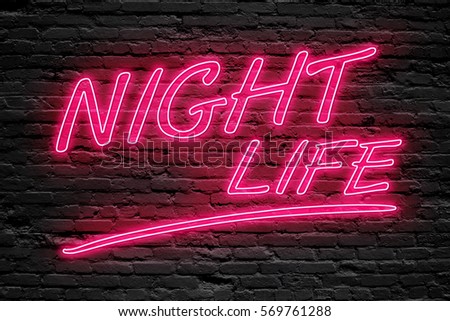 NIGHT LIFE concept. fluorescent Neon tube Sign on dark brick wall. Front view. Can be used for online banner ads or background. night moment.