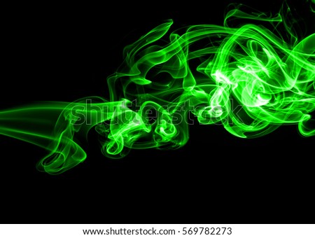 Movement of green smoke on black background