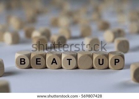 beat up - cube with letters, sign with wooden cubes