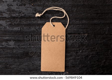 paper label on black wooden background