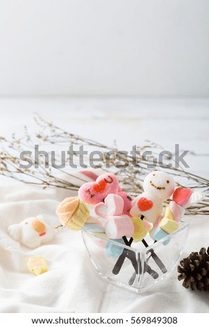 valentine candy with white fabric on wooden background