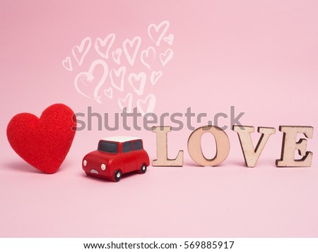 Vintage car carry a  gift box on color background and top wood table for Christmas and The New Year and Valentine's day .Decoration love heart .