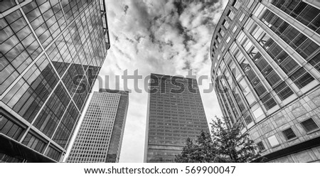 Canary Wharf. Beautiful view of Skyscrapers and trees from street level - London.
