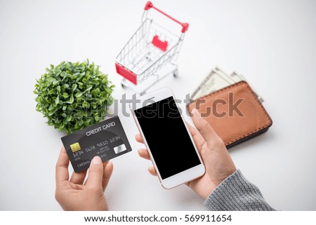 Online shopping concept. Mobile phone or smartphone with cart