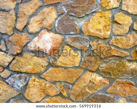Texture of a multicolored stone wall
