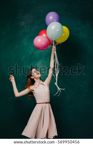 A woman is flying in a balloon