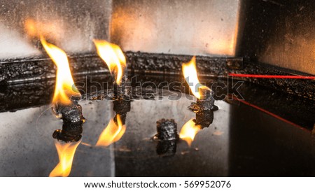 candle and flame in Thai Temple