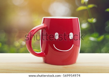 Red mug of coffee with a happy smile, Good day, Good morning or Have a happy day concept