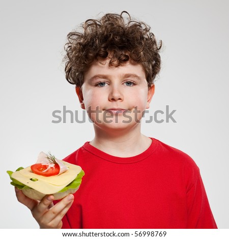 Boy eating sandwich