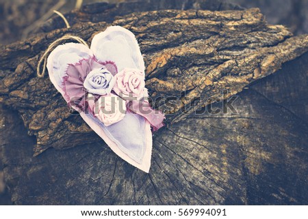 Hand-made heart on a wooden background. Background, Valentine's Day, Mother's Day