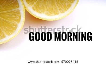 Conceptual image of Healthy Concept with words " Good Morning" and slice of lemon on a white background with selective focus.