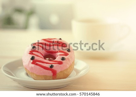 Delicious donuts on wooden table  closeup