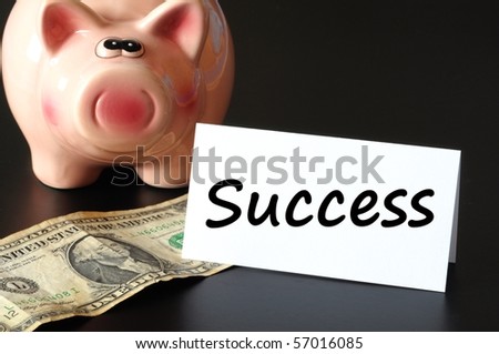 financial success concept with piggy bank on black background