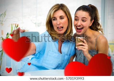 Hearts against mother taking selfie with daughter 3D