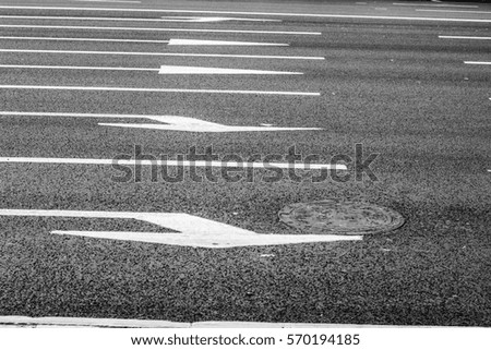 Lane markings and direction of movement on the asphalt road. Street in the city center. A vacation in Russia, Yekaterinburg.