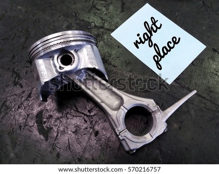 conceptual image of piston assembly and word - Right place with black background/selective focus/low light.