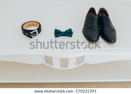 Trendy men's strap bow tie and shoes. Accesories, close-up