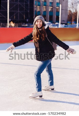 Pretty teenage girl ice skating