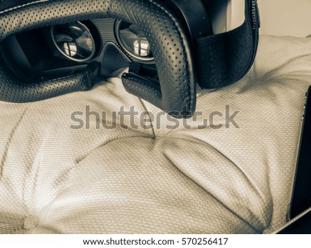 Virtual reality digital device on the textile beige background