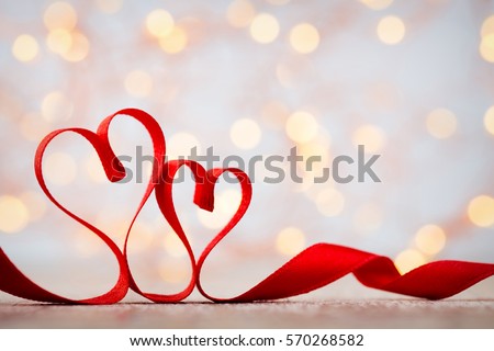 Two red hearts of ribbon. Valentines day greeting card.