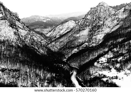 Black and white photo Winter canyon of Tara river (Kanjon rijeke Tare) in Montenegro. View from the railway bridge