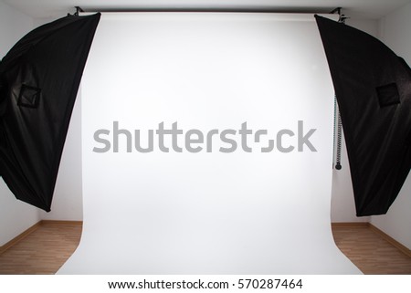 Photo studio equipment with white background. Space for text