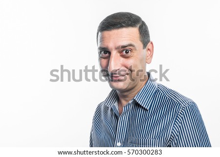 Portrait of a man making funny face against white background
