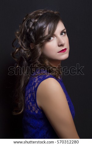 Elegant hairstyle with braids on beautiful woman. Studio photography