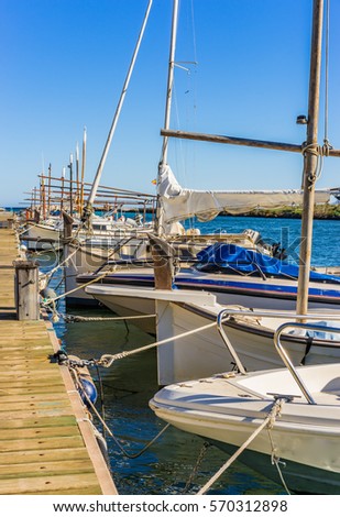 Boats anchoring at dock, marine background.