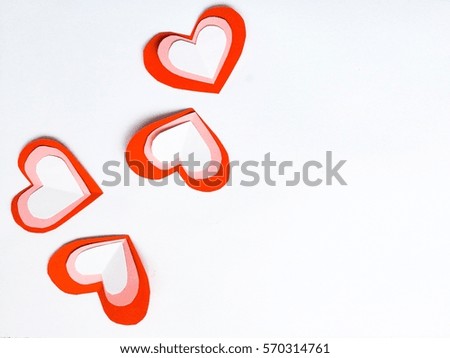Fold paper Red White  hearts {Paper Heart stacked}, Heart of paper folding Isolated on White Background. Cards for Valentine's Day There is space for text "Happy Valentine's Day"