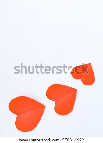 Fold paper Red  hearts {Paper Heart cutting}, Heart of paper folding Isolated on White Background. Cards for Valentine's Day There is space for text "Happy Valentine's Day"