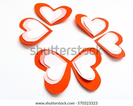cutting paper Red White  hearts {Paper Heart stacked}, Heart of paper folding Isolated on White Background. Cards for Valentine's Day There is space for text "Happy Valentine's Day"