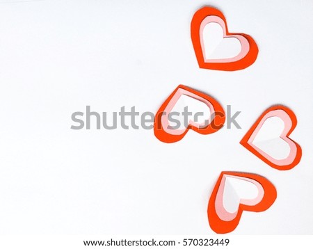 cutting paper Red White  hearts {Paper Heart stacked}, Heart of paper folding Isolated on White Background. Cards for Valentine's Day There is space for text "Happy Valentine's Day"