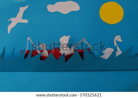 Landscape created from colored paper. A boat with two fishermen at sea, a swan and a seagull