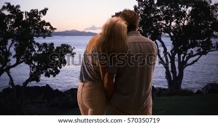 Senior couple enjoying the great outdoors together and watching the sunset