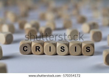 crisis - cube with letters, sign with wooden cubes