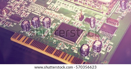 Printed Circuit Board with many electrical components. Close up image. Technology and hardware electronic concept. Toned picture