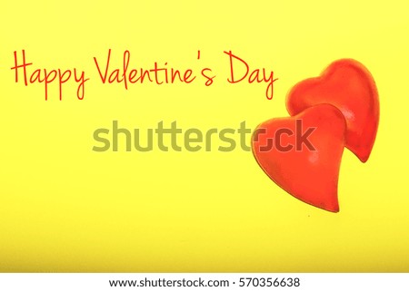 Happy Valentine's Day, plastic hearts on yellow background