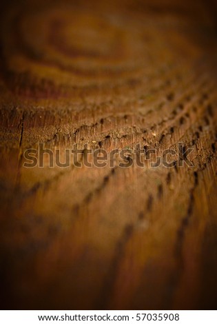 Dark vintage wood texture, shallow DOF.